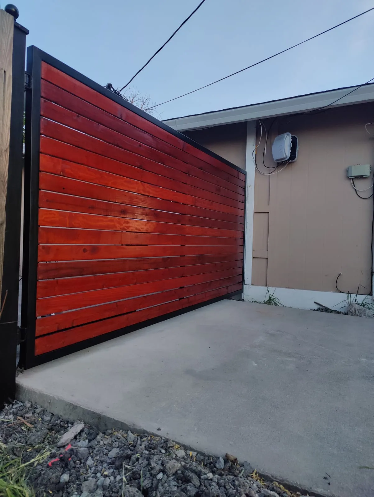 RedStainedWoodandIronDrivewayGate