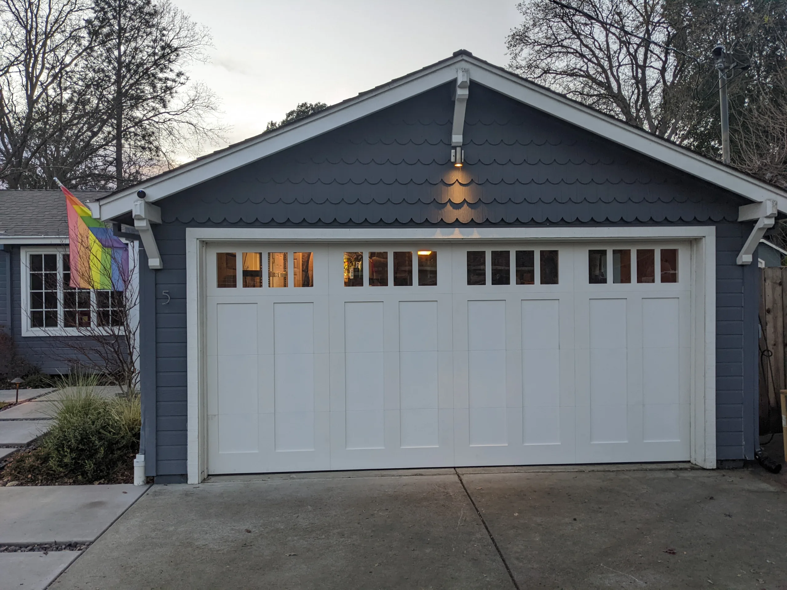 WoodGarageDoorPaintedWhiteWithWindows